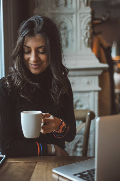 istock Pretty young woman using phone, sitting in the cafe 1152577198