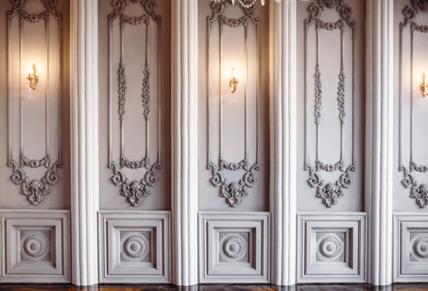 istock classic wall interior and modern frame with gold lamps with columns and modeling 1152578876