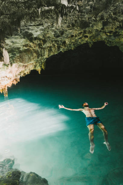 istock Man swimming in cave on Flores Island 1152579950