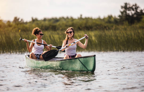 istock Two Women Canoeing on The Lake 1152580161