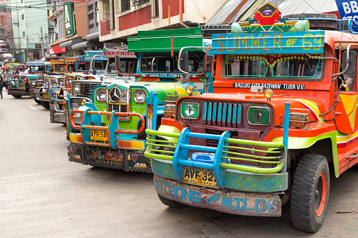 Baguio, Philippines - June 3, 2016: Jeepney station with colourful jeepneys lined up
