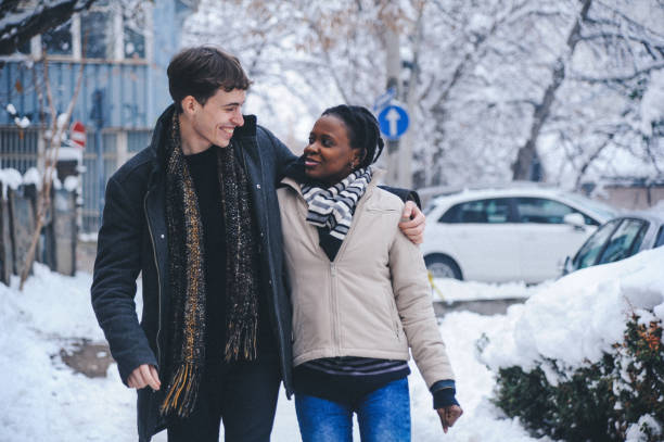 istock Young couple playing with snow 1152581352