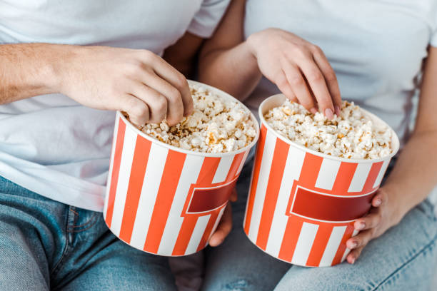 istock partial view of couple in jeans with popcorn 1152582840
