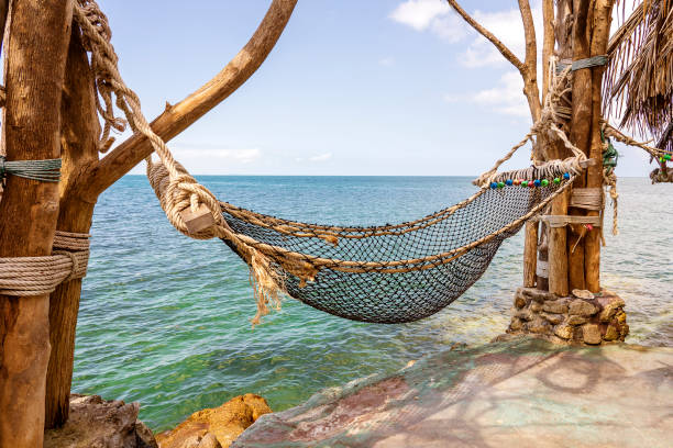 istock Empty hammock on beautiful tropical beach near sea water Thailand 1152582861