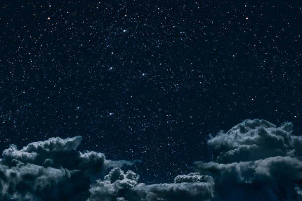 istock a backgrounds night sky with stars and moon and clouds. 1152583165