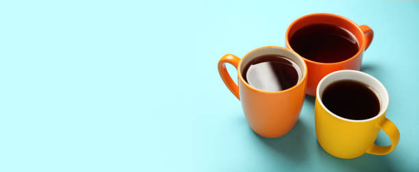 istock Black tea (coffee) in bright cups, office break, team building 1152583677
