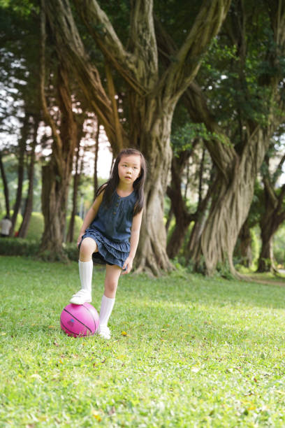 Family holiday activities kick ball.