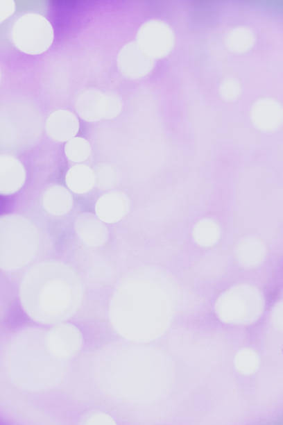 istock Sparkling Defocused Lights on Purple Abstract Background 1152587948