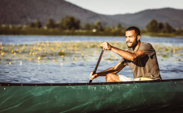 istock Young Man Canoeing on The Lake 1152590540