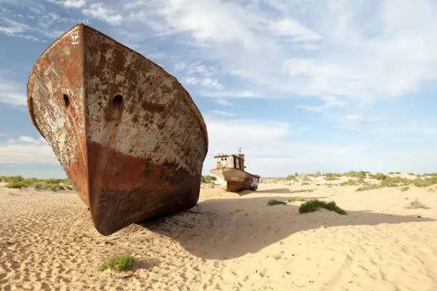Abadoned shipwreck in Aral Desert near Munyak Port on seabed of former Aral Sea, Munyak Karakalpakstan, Uzbekistan.