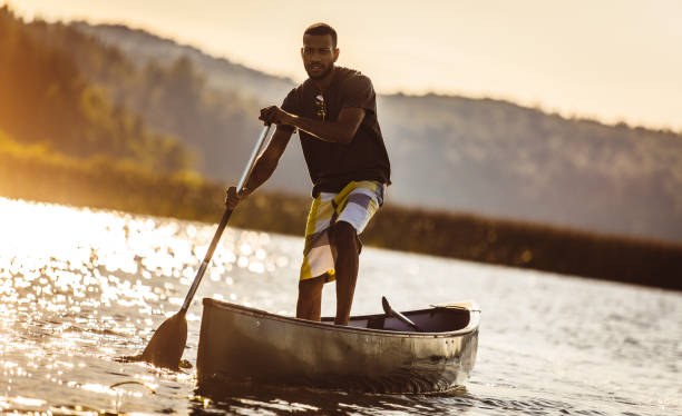 istock Young Man Canoeing on The Lake 1152592532