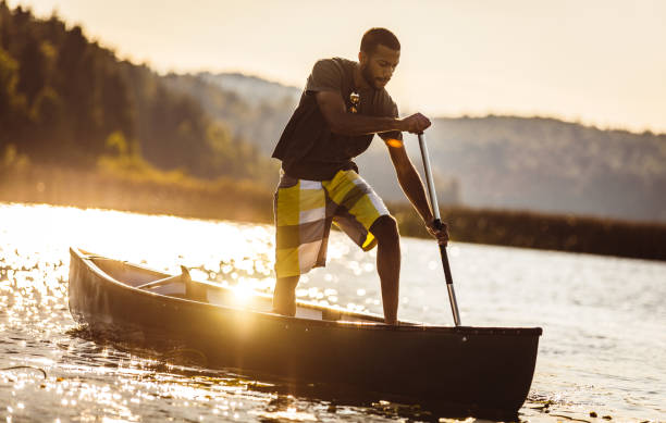 istock Young Man Canoeing on The Lake 1152592676