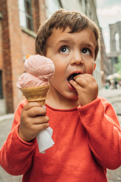 istock Boys having Icecream in Brooklyn with Brooklyn Bridge in the background 1152592885