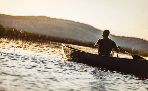 istock Young Man Canoeing on The Lake 1152594003