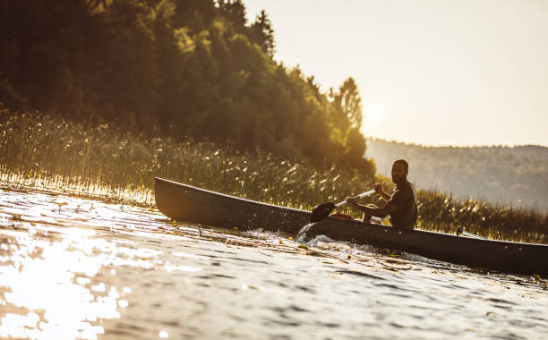 istock Young Man Canoeing on The Lake 1152594105