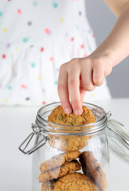 Hand in the cookie jar stock photo