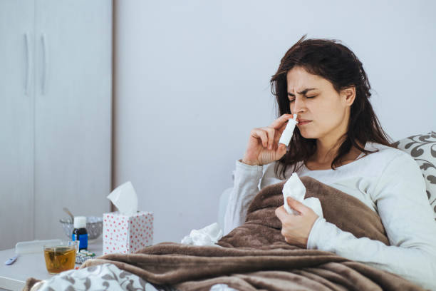 istock Woman Suffering From Cold Lying In Bed With Tissue 1152594230