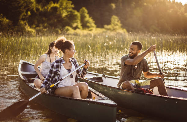 istock Friends Canoeing on The Lake 1152596339