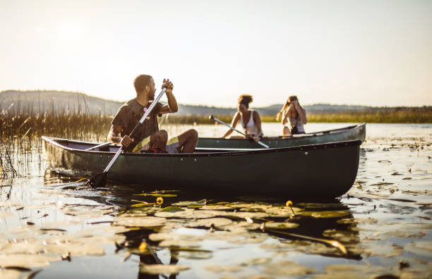 istock Friends Canoeing on The Lake 1152596791