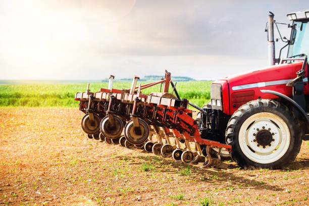 istock farmer passing the harrow in his fields 1152596983