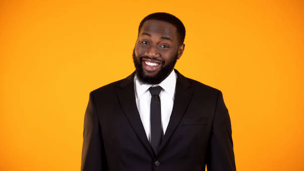 istock Black businessman smiling to camera, salesman making proposition, discounts 1152597775