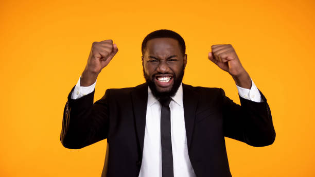 istock Extremely happy black employee smiling and making yes gesture, getting promotion 1152597788