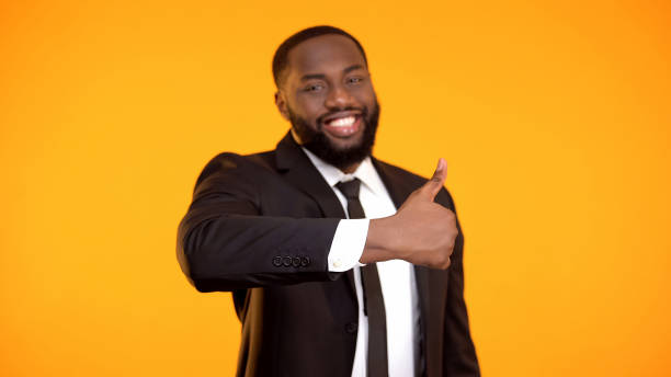 istock Smiling confident black businessman making thumbs-up gesture, excellent service 1152597833