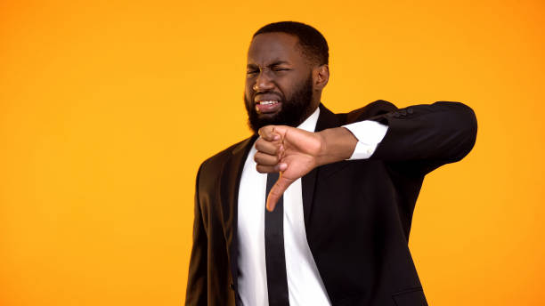 istock Disgusted black businessman making thumbs-down, consumer rights protection 1152597851