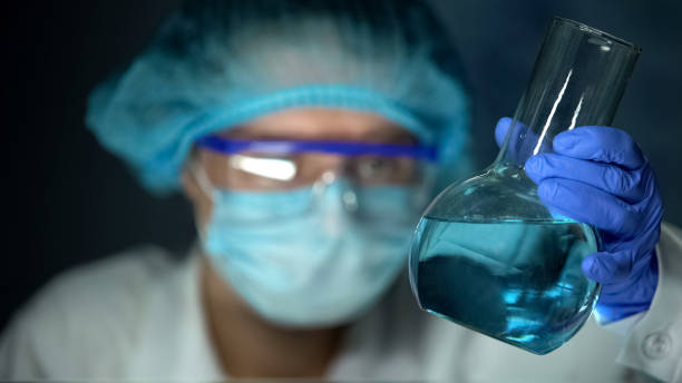 istock Chemist holding flask with blue liquid, domestic detergents production, lab 1152598159