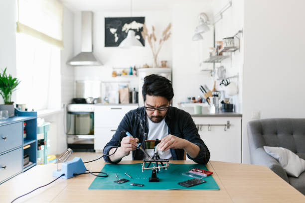 istock Japanese man vlogging while repairing his smart phone at home 1152598429
