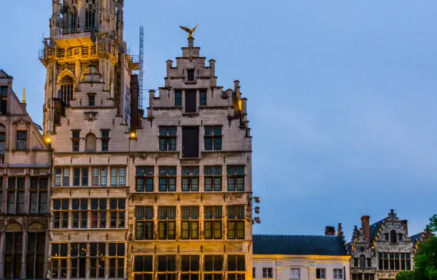 Photo of beautiful historic architecture in the center of antwerp city, Classical cottages by night in antwerpen, Belgium