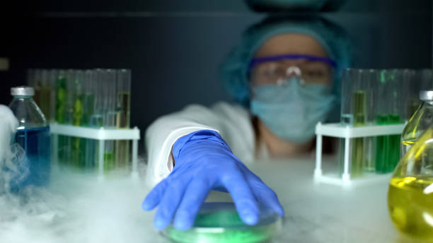 istock Lab assistant taking green powder from fridge, dermatology cryotherapy material 1152598756