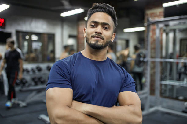 istock Confident young macho male with arms crossed 1152600445