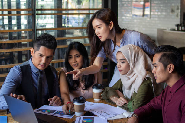 istock businesspeople having meeting a modern cafe with multi-ethnic team 1152600453
