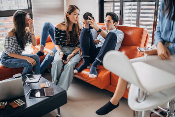 istock Millennial friends watching mobile phones 1152600483