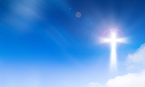 holy light of crucifix cross on blue sky background. hope and freedom concept. - heaven light day god imagens e fotografias de stock