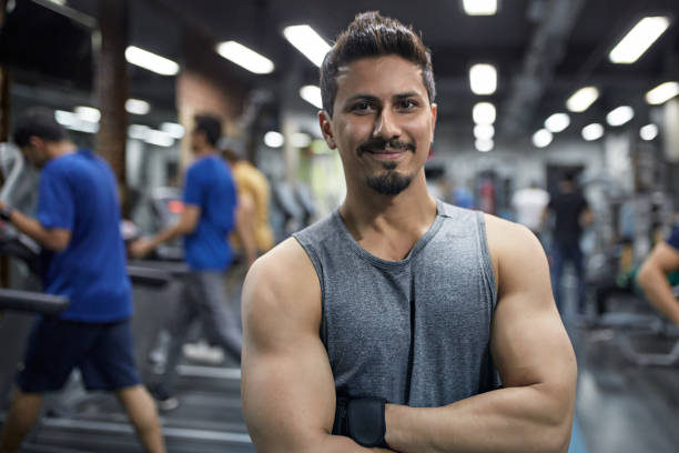 istock Confident young muscular man with arms crossed 1152600496