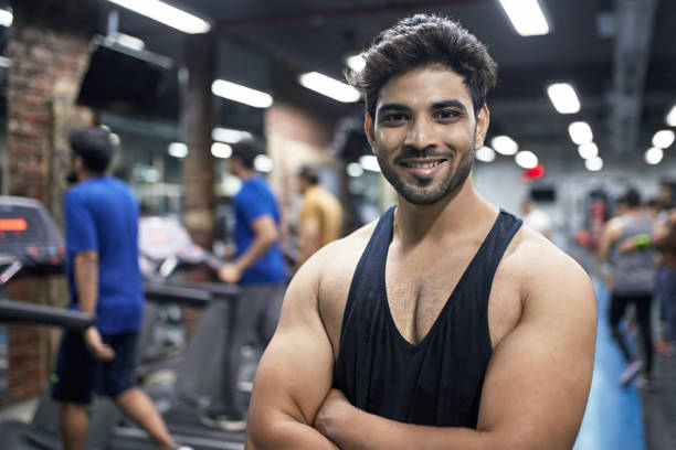 istock Smiling young muscular man with arms crossed 1152601042