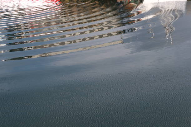 Blurred swimming pool waterfall in the hotel. Abstract background