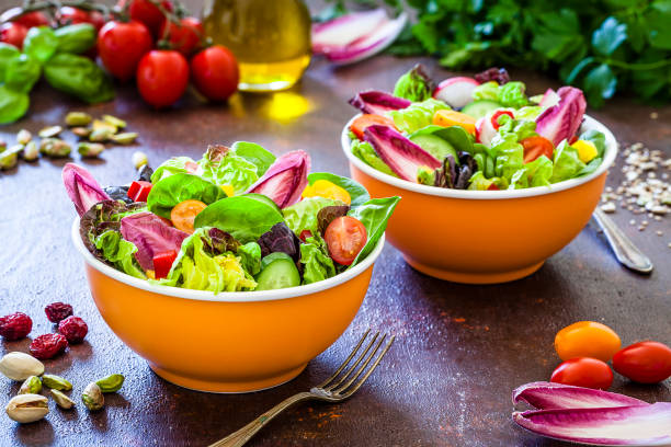 istock Healthy eating: two fresh salad bowls ready to eat 1152601331