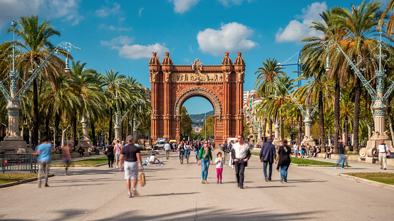 Barcelona, Spain - October 24, 2018: Tourists and locals at Arc de Triomf on a sunny day in Barcelona, Catalonia, Spain.