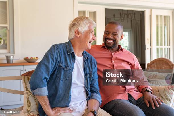 Happy Men In A Conversation Stock Photo - Download Image Now - Friendship, Men, Discussion