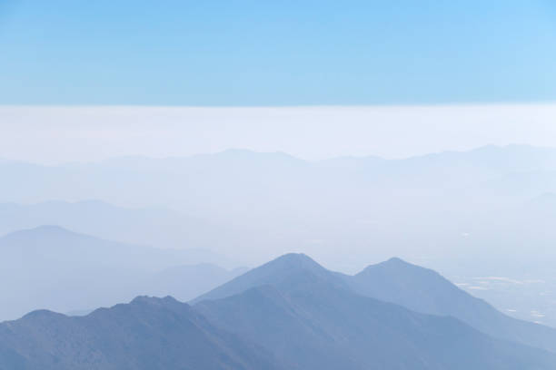 istock Abstract cascade mountain chains silhouette landscape nackground in a light blue mist sky in morning Andes 1152603400