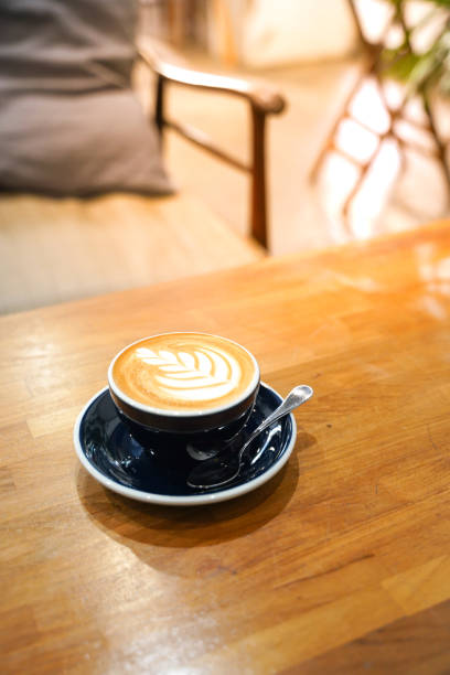 istock Latte coffee on wood table 1152603958