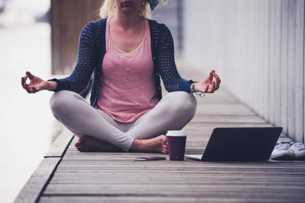istock Unknown female doing yoga at pier. 1152604011