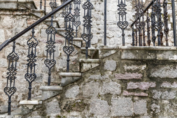 istock Old stone stairs with wrought iron railings 1152604508