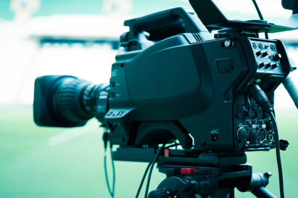 istock Video camera lens - recording show in TV studio - focus on camera aperture 1152604596