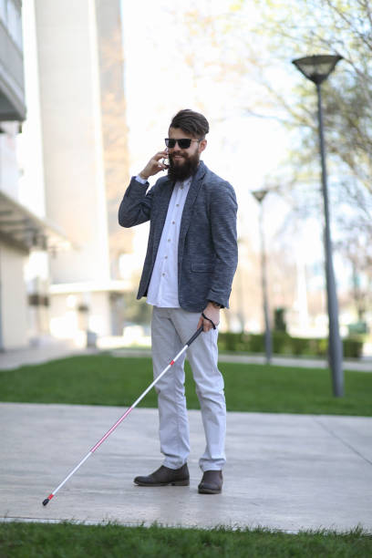 istock Young beautiful bearded man with walking sticks on the street 1152605519
