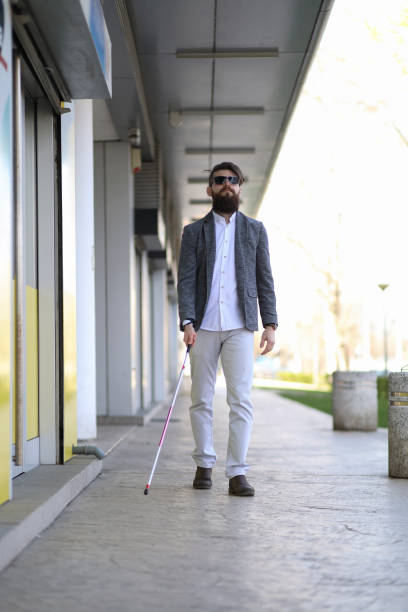 istock Young beautiful bearded man with walking sticks on the street 1152605526