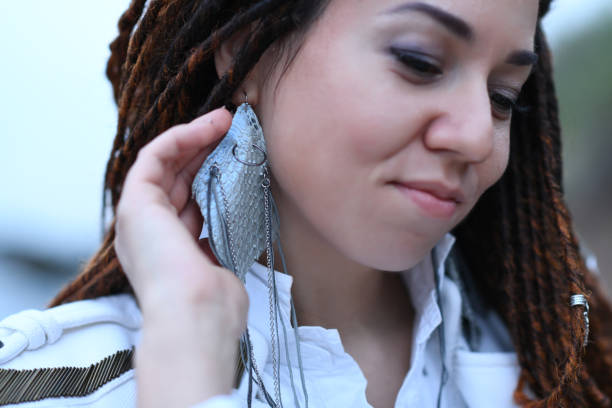 istock dreadlocks fashionable girl posing with earring 1152605673